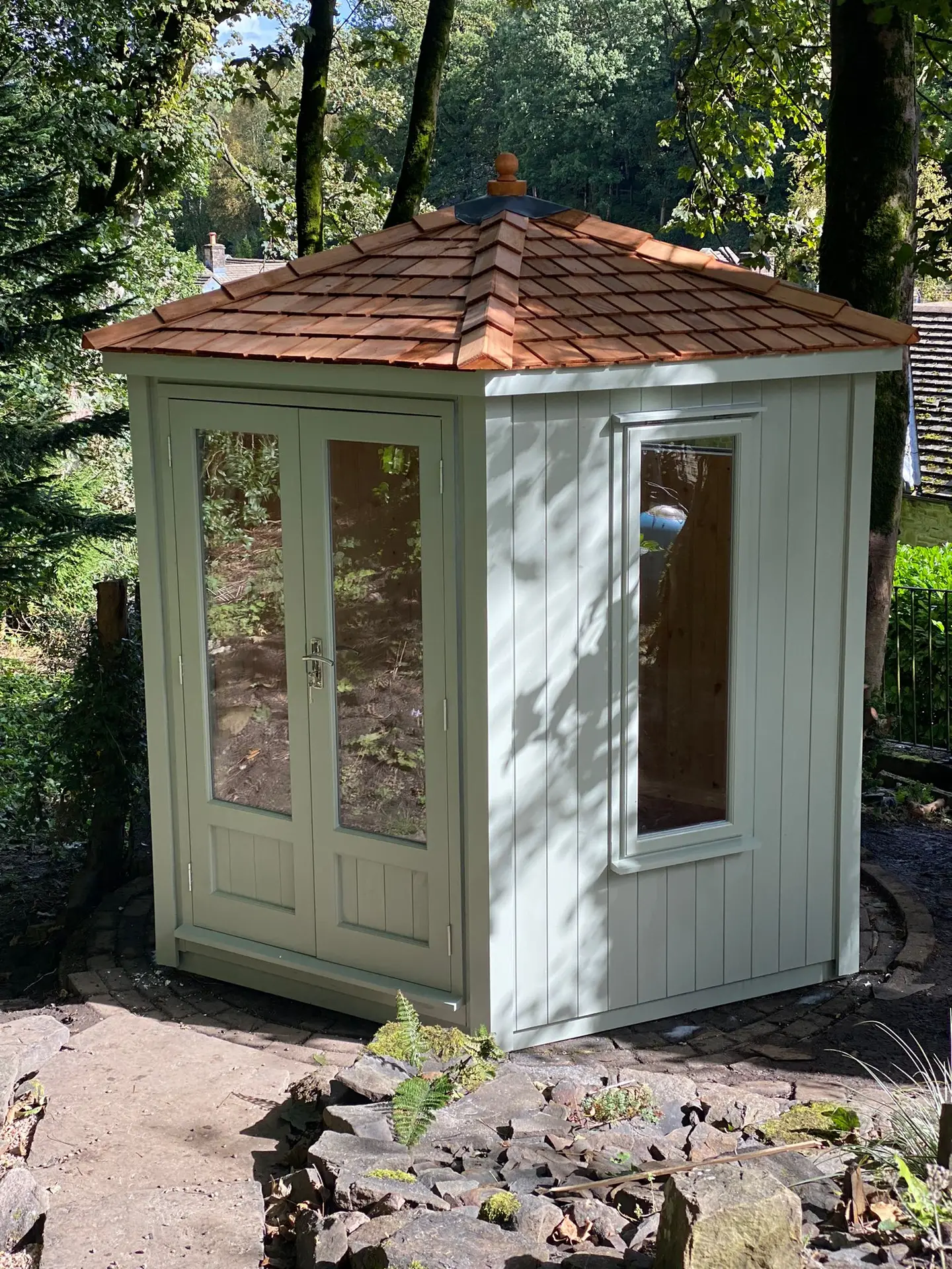 Corner Summerhouse with a vaulted Western Red Cedar roof fully lined and insulated with double glazing
