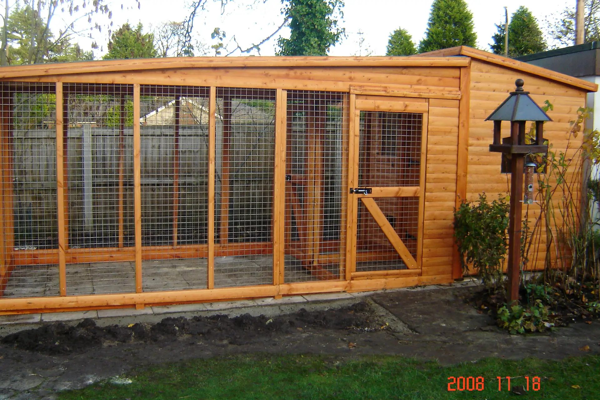 This is a cattery with a sleeping compartment and a covered run