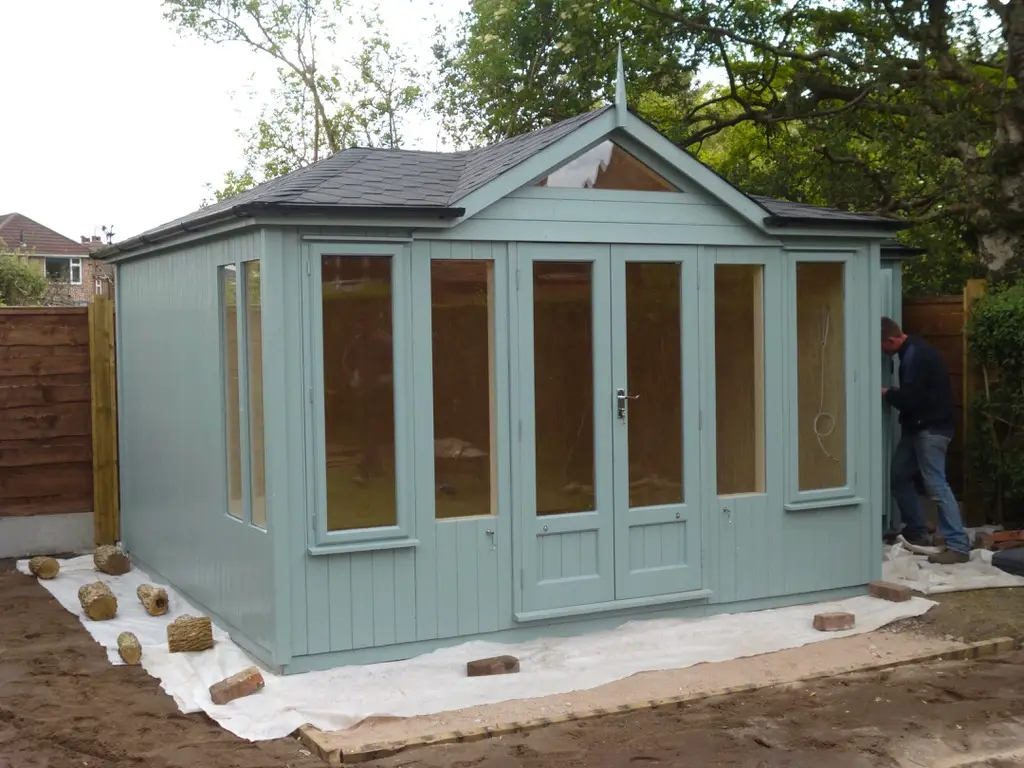 THIS IS A CONTEMPORARY SUMMERHOUSE WITH A MULTI SHAPED ROOF