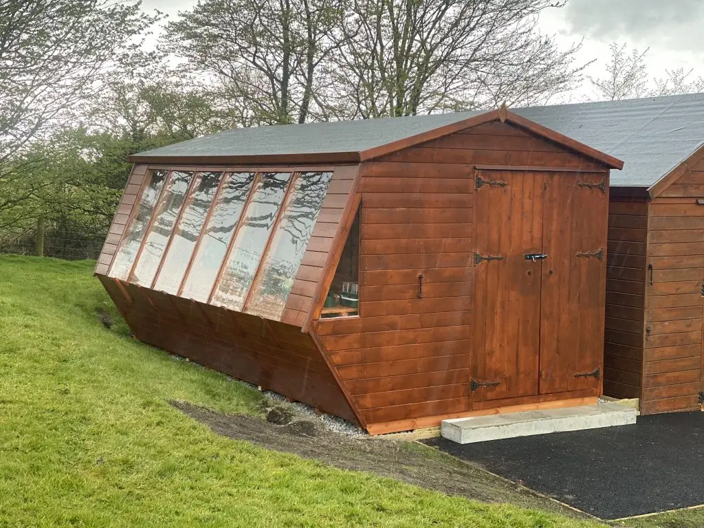 THIS IS A PHOTO OF A HUGE POTTING SHED FOR A KEEN GARDENER