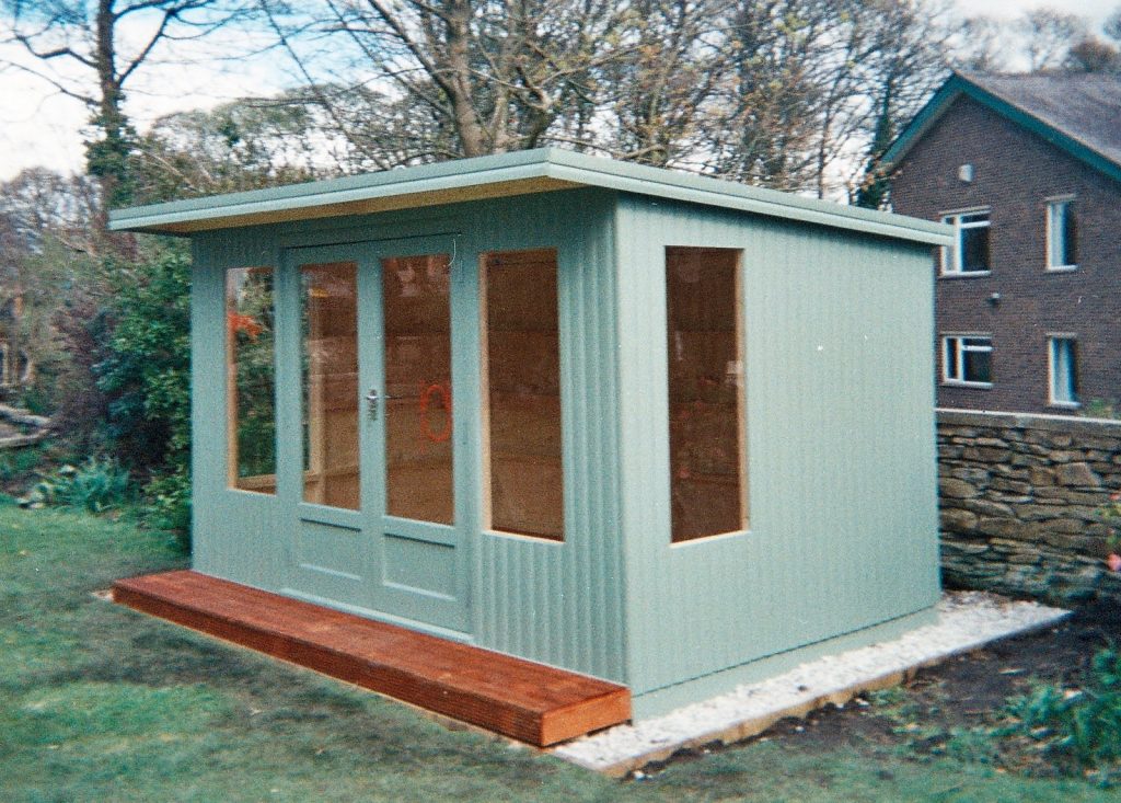 THIS IS OUR KINGFISHER SUMMERHOUSE PAINTED IN GREEN