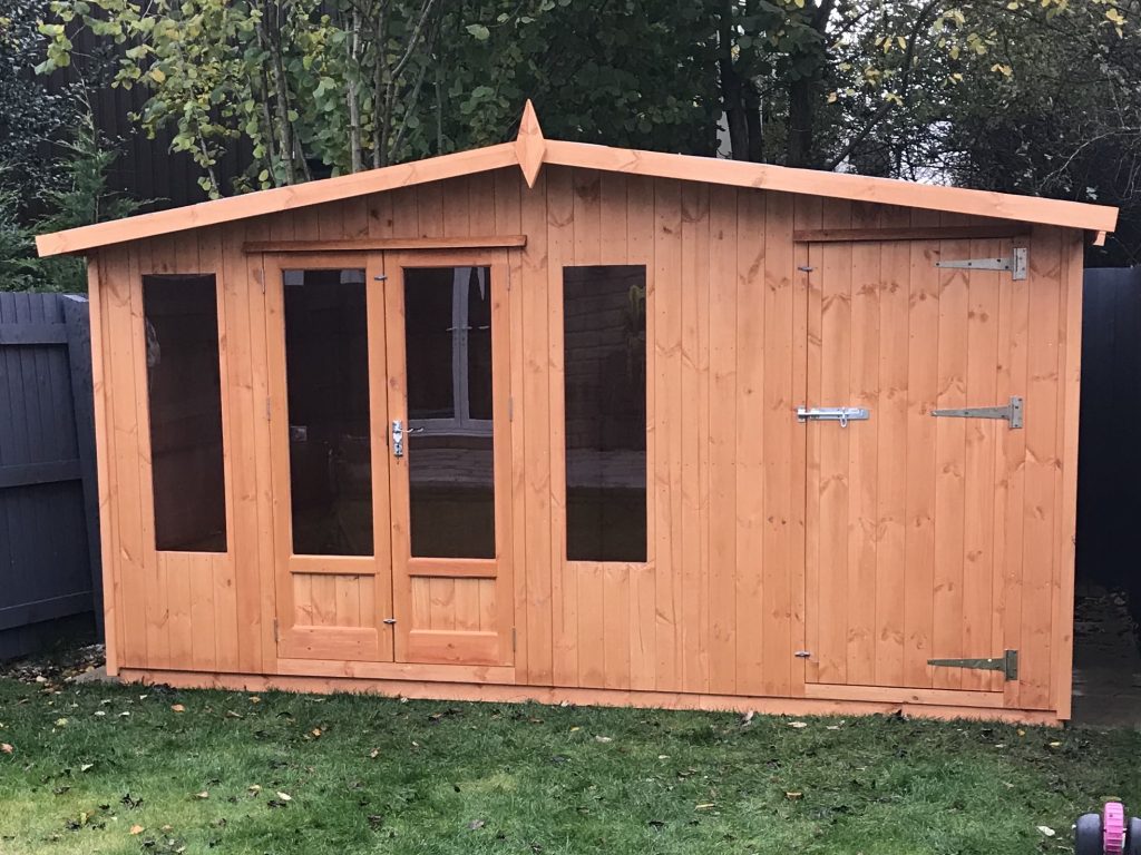 SUMMERHOUSE WITH BUILT IN STORAGE AREA TO THE FRONT