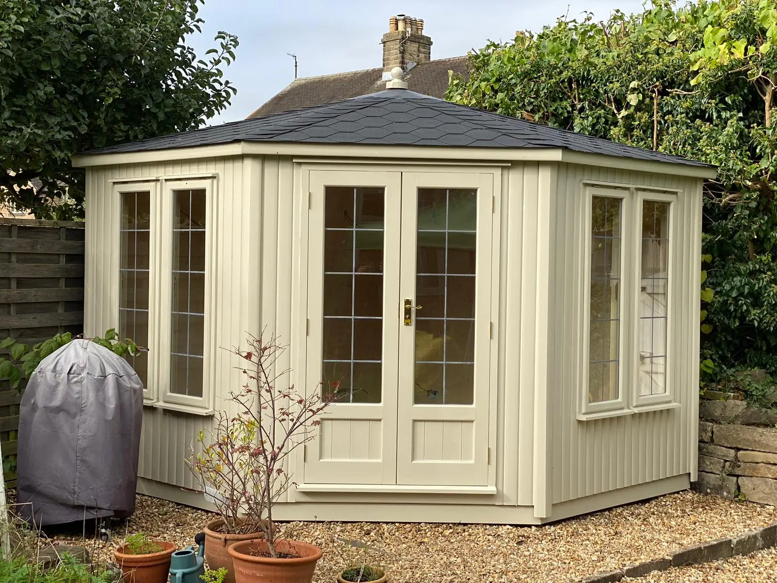 Contemporary Corner Summerhouse with leaded double glazed windows, fully lined and insulated with electrics and painted exterior.