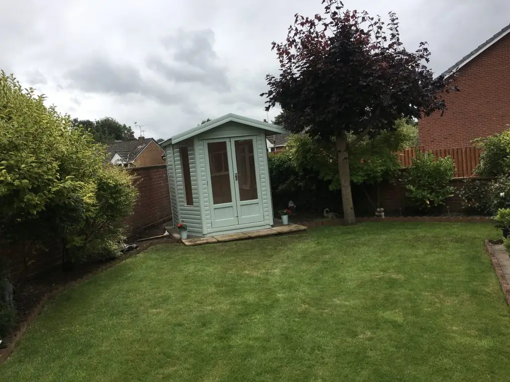 THIS IS A PHOTO OF OUR ROBIN SUMMERHOUSE WITH TWO CORNERS CUT OFF